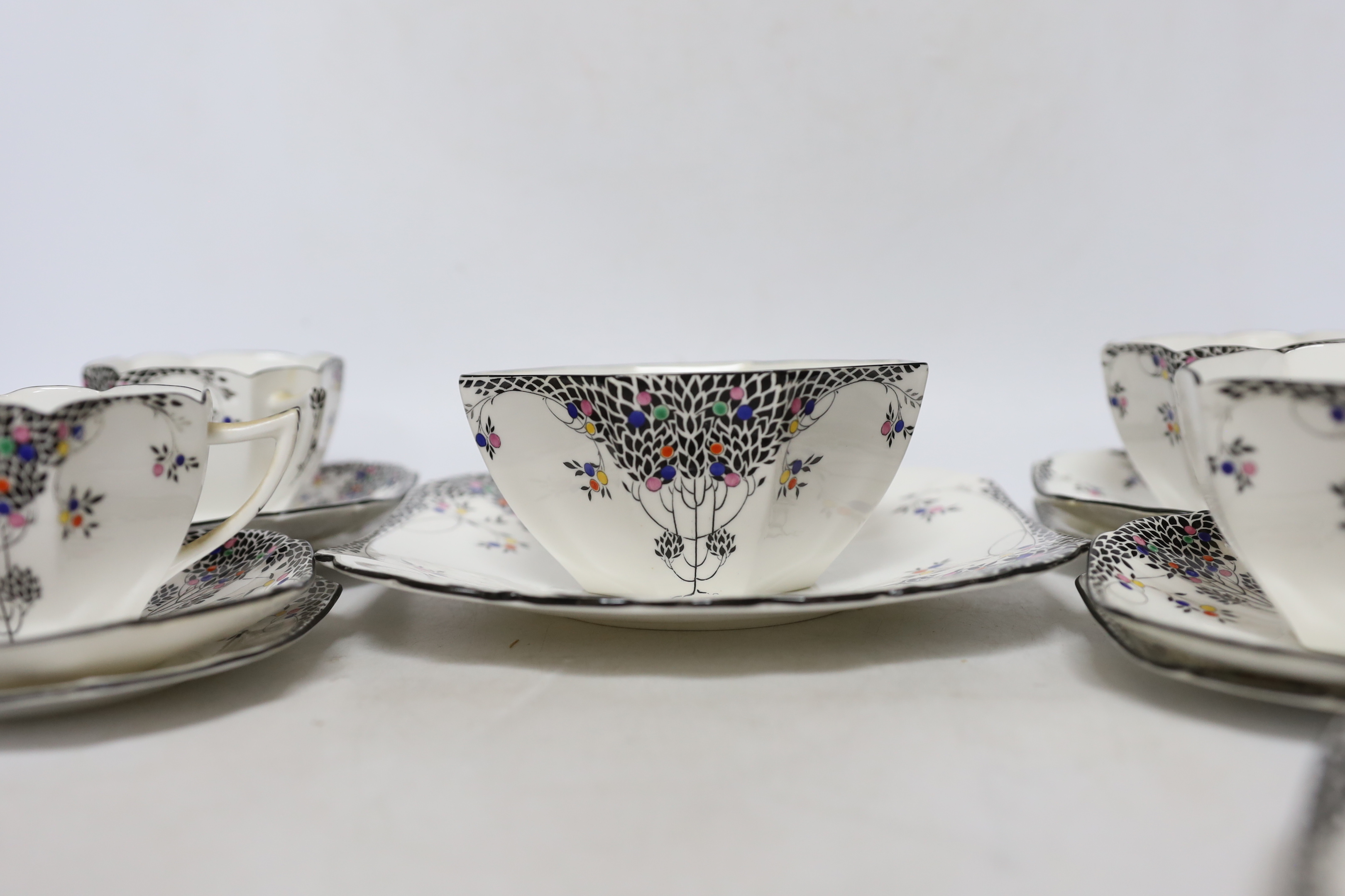 A Shelley Black Leafy Tree pattern part tea set comprising trios, milk jug, bowl and sandwich plate